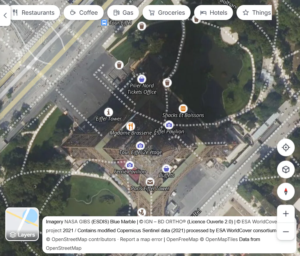 The Satellite page zoomed in on the Eiffel Tower in Paris: a sharp aerial photograph with street names and places drawn on top, and the credit for the photo source at the bottom of the map